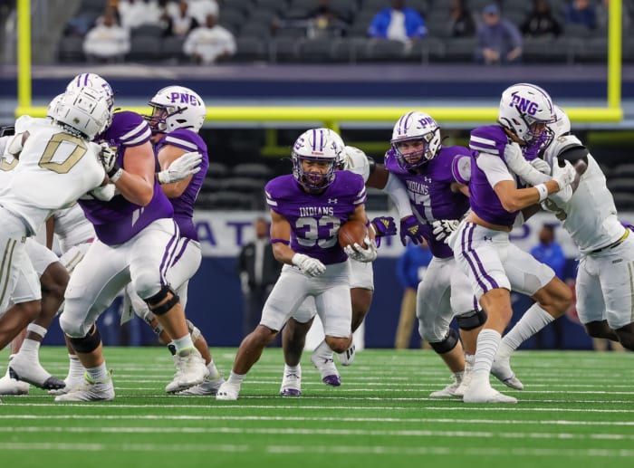 Isaiah Nguyen takes a carry during the first half of the 5A Division II Texas UIL state title on Saturday at AT&T Stadium. The PNG running back